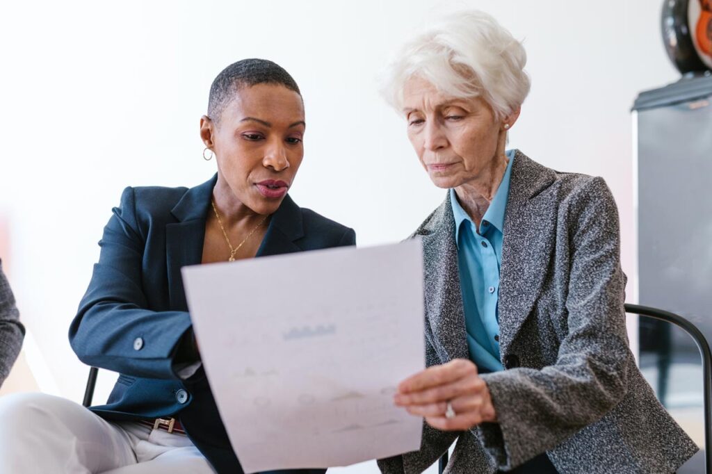 Two women discussing a commercial project